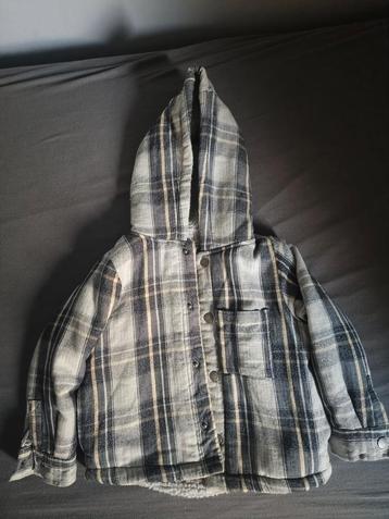 Dik gevoerd vest met capuchon beschikbaar voor biedingen