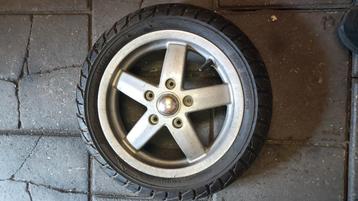 Tekoop velg met nieuwe band vespa lx  beschikbaar voor biedingen