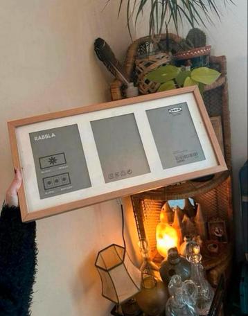 Twee houten fotolijsten voor drie grote foto’s van ikea beschikbaar voor biedingen