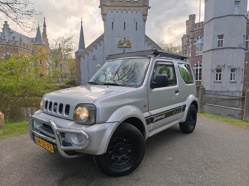 Suzuki Jimny 1.3 4x4 / trekhaak / roofrek / apk 10-2026!!, Stof, 40 €/maand, 4 cilinders, 4 stoelen