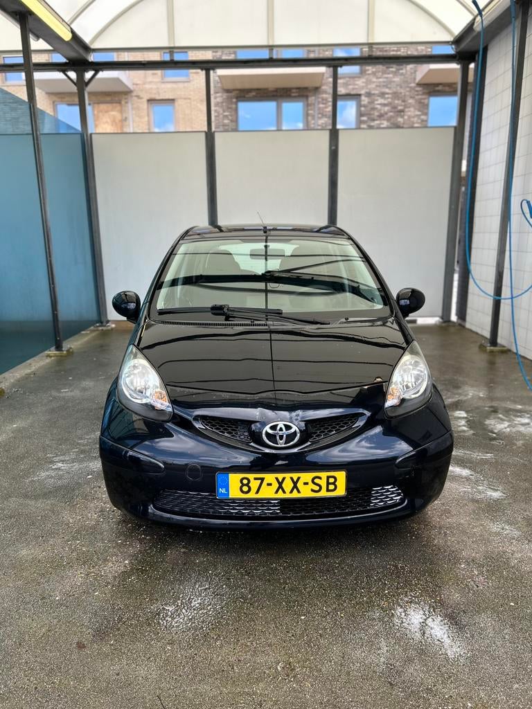 Toyota Aygo 1.0 12V Vvt-i 5DRS 2007 Zwart, Auto's, Toyota, Voorwielaandrijving, Stof, 4 stoelen, Origineel Nederlands