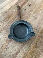 tinnen asbak, Ophalen