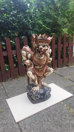 Houten Garuda Beeld, Ophalen