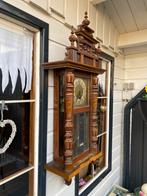 Antieke houten wandklok met slinger (Adler Gong), Ophalen