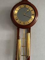 Mahoniehouten klok met gouden kettingen en gewichten, Ophalen