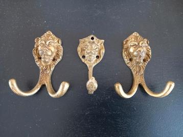 Vintage messing leeuwekop haken beschikbaar voor biedingen