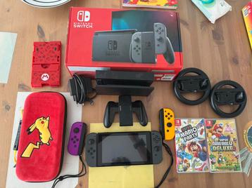 Nintendo switch + controlers + wheels + case + game beschikbaar voor biedingen