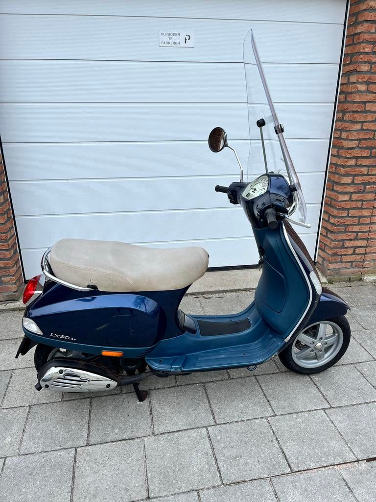 Vespa LX 50 - Blauw - Gebruikt met lichte schade, Fietsen en Brommers, Scooters | Vespa, Ophalen, Gebruikt, Maximaal 45 km/u, Benzine