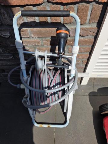 te koop tuinslang met haspel goed voor tweede ronde zie foto beschikbaar voor biedingen