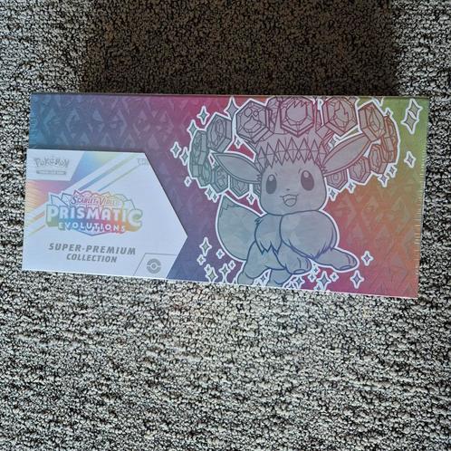 Pokemon Prismatic Evolutions super-premium collection Engels, Hobby en Vrije tijd, Verzamelkaartspellen | Pokémon, Nieuw, Boosterbox