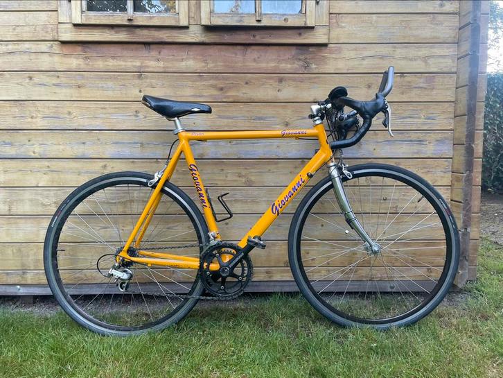 Geel/oranje Giovanni racefiets, Fietsen en Brommers, Fietsen | Racefietsen, Zo goed als nieuw, Heren, Overige merken, 15 tot 20 versnellingen