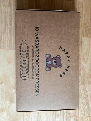 Wasbare zoogcompressen Happy Bear beschikbaar voor biedingen