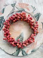 Krans met oranje rode besjes, Ophalen