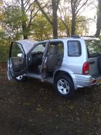 Suzuki Grand Vitara 2.5 V6 5D AUT 1999 Grijs, Auto's, 74 €/maand, Beige, Grand Vitara, Origineel Nederlands