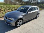 BMW 1-Serie 118i 143pk 3D Aut. 2009 Grijs + winterset, Euro 5, 1995 cc, Zwart, 4 stoelen