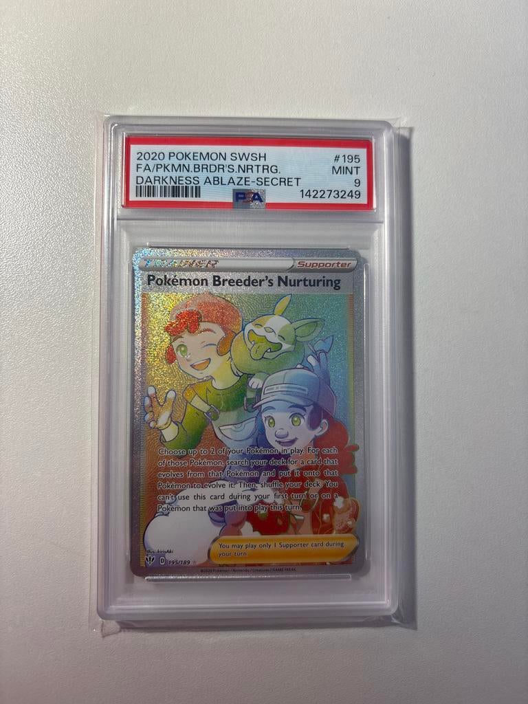 PSA 9 Breeder's Nurturing #195 Darkness Ablaze, Hobby en Vrije tijd, Verzamelkaartspellen | Pokémon, Ophalen of Verzenden, Zo goed als nieuw