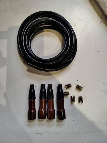 NOS bougie kabel set met 4x bougiedop. Ca. 50 jaar oud beschikbaar voor biedingen