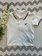 NIEUW, wit poloshirtje met dino van de Primark, maatje 86, Kinderen en Baby's, Babykleding | Maat 86, Nieuw, Ophalen of Verzenden