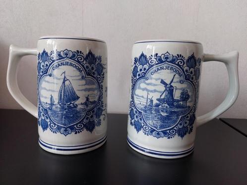 2 Oranjeboom bierpullen van Delfts blauw aardewerk, Verzamelen, Biermerken, Zo goed als nieuw, Pul(len), Oranjeboom, Ophalen