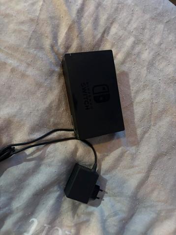 Nintendo switch dock met oplader beschikbaar voor biedingen
