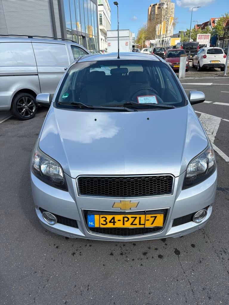 Chevrolet Aveo 1.2 16V 5D 62KW 2011 Grijs, Auto's, Voorwielaandrijving, 1206 cc, 40 €/maand, 400 kg