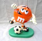 M & M voetbal pop mascotte dispenser hard kunststof 24 cm., Zo goed als nieuw, Verzenden, Gebruiksvoorwerp