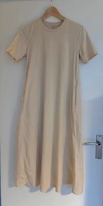 Nieuwe T-shirtjurk van Uniqlo (XS)., Beige, Nieuw, Ophalen of Verzenden, Maat 34 (XS) of kleiner