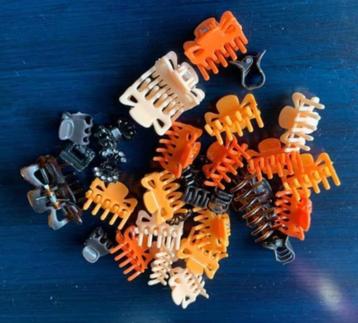 Haarklemmetjes in verschillende kleuren; oranje, bruin, grij beschikbaar voor biedingen