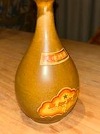 Kruikje Wu Chia Pi Chiew met kruidendrank, Ophalen