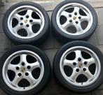 Porsche 17 inch Cup 2 velgen met banden en centercaps, Ophalen of Verzenden, Gebruikt