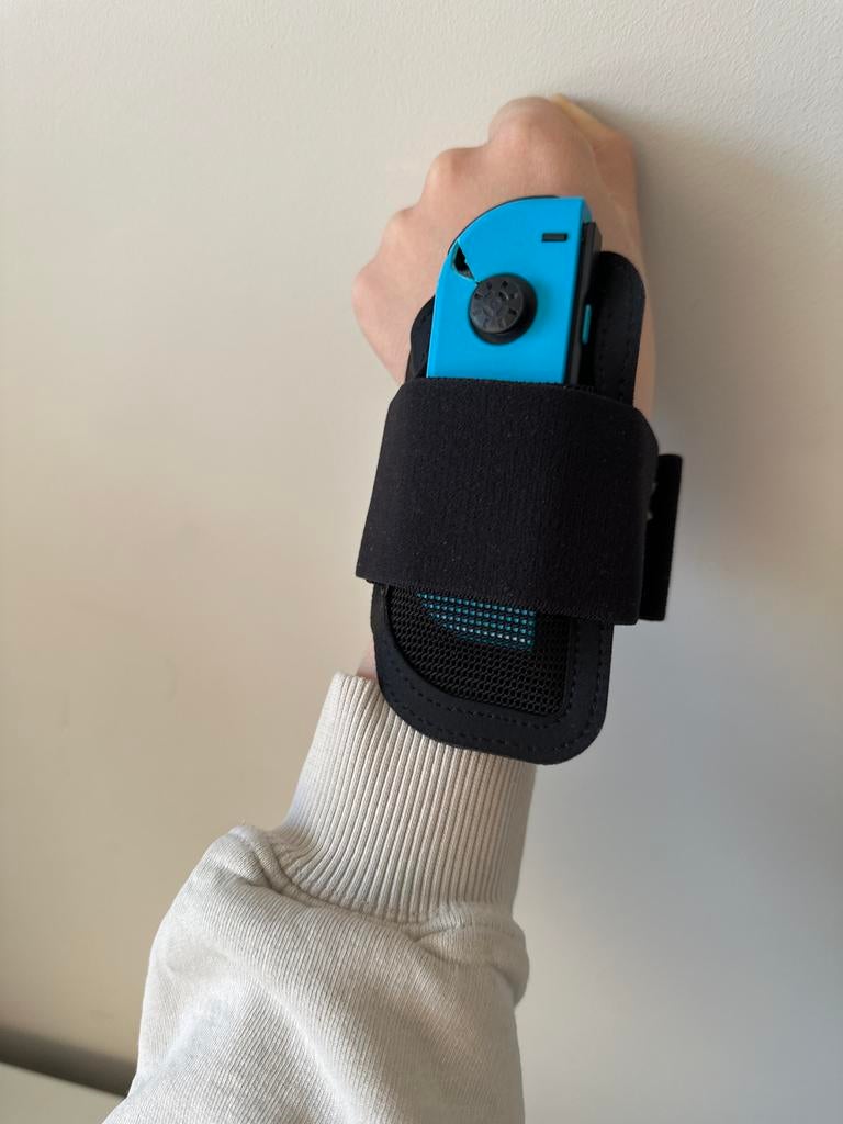 Nintendo Switch Joy-Con Polsbandhouder Links, Ophalen of Verzenden, Zo goed als nieuw, Switch, Overige controllers