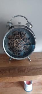 Tandwiel klok, Ophalen