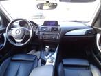 BMW 1-serie 116i Upgrade Edition AUTOMAAT | PANORAMDAK | CRU, Gebruikt, Zwart, 4 cilinders, Wit