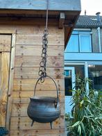Heksenketel met ketting, Ophalen