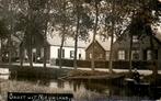 Nieuwland - Huizen aan het water - Mensen in boot, Verzamelen, Ansichtkaarten | Nederland, Ophalen of Verzenden, 1920 tot 1940