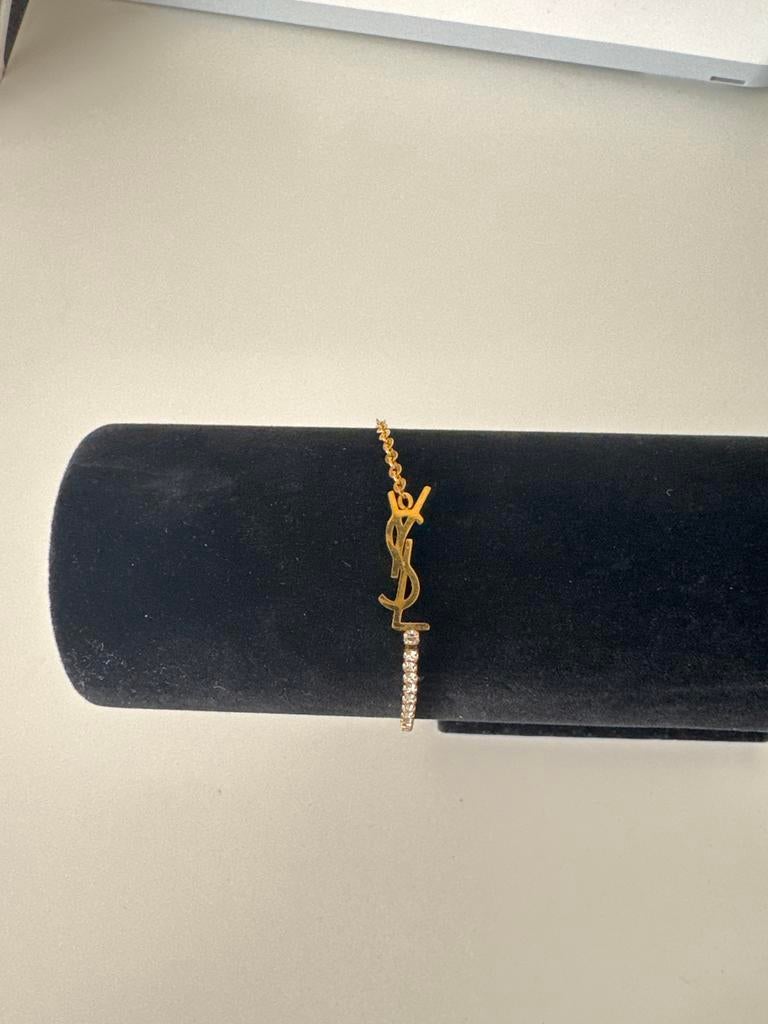 Gouden armband met YSL-logo en strass, Sieraden, Tassen en Uiterlijk, Armbanden, Overige materialen, Ophalen of Verzenden, Zo goed als nieuw
