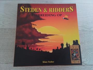 999 Games : De kolonisten van Catan : Steden & Ridders hout beschikbaar voor biedingen