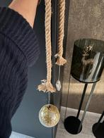 Kerstbal aan touw, Ophalen