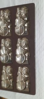 Oude chocolademal aap met een bas ( muziekinstrument), Ophalen of Verzenden