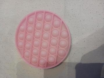 Roze ronde pop-it  beschikbaar voor biedingen