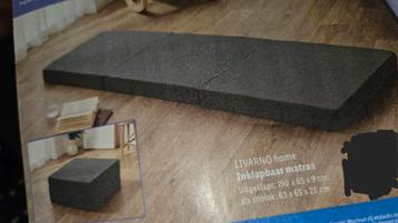 Inklapbaar matras nog nieuw zwart/wit beschikbaar voor biedingen