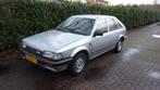 Mazda 323 1.3 HB LX AUT K6 1989 Grijs, Auto's, Origineel Nederlands, Te koop, Zilver of Grijs, Benzine