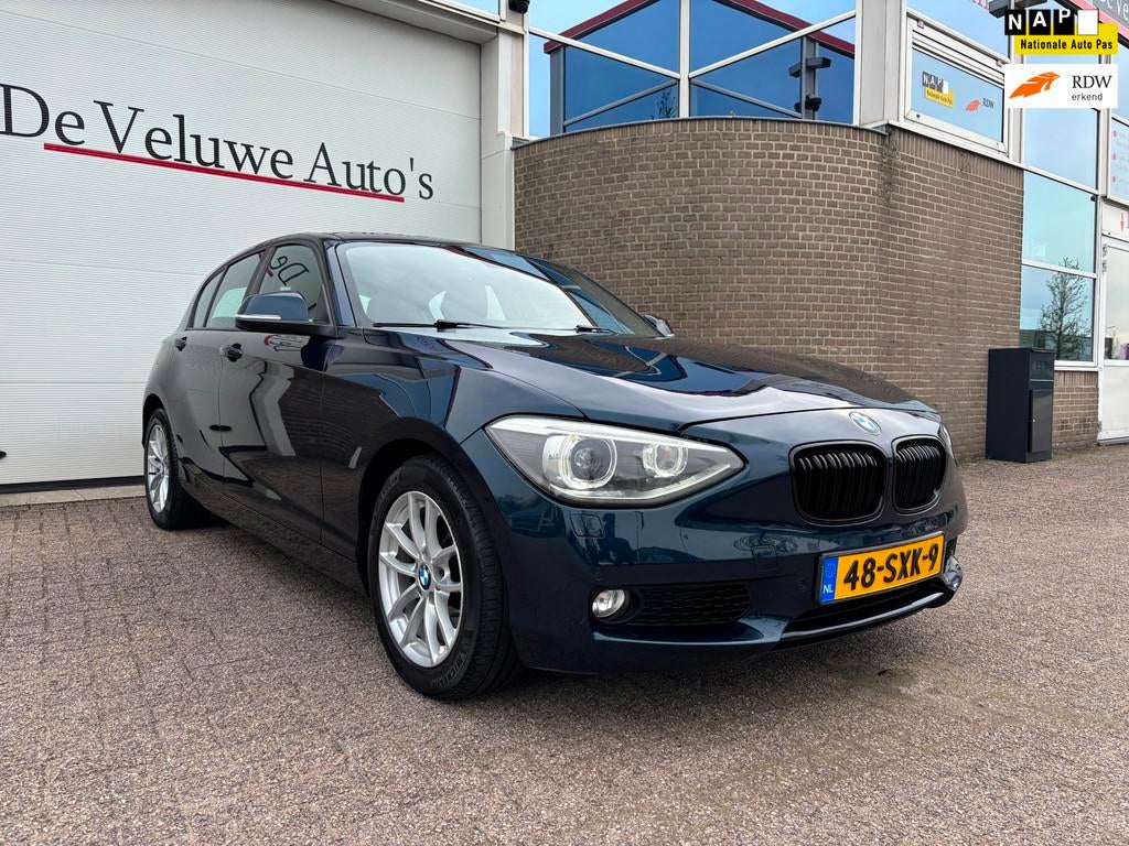 BMW 1-serie 118i Business 170PK|Sport|Cruise|Navi|Automaat, Auto's, Euro 5, Gebruikt, Zwart, 4 cilinders