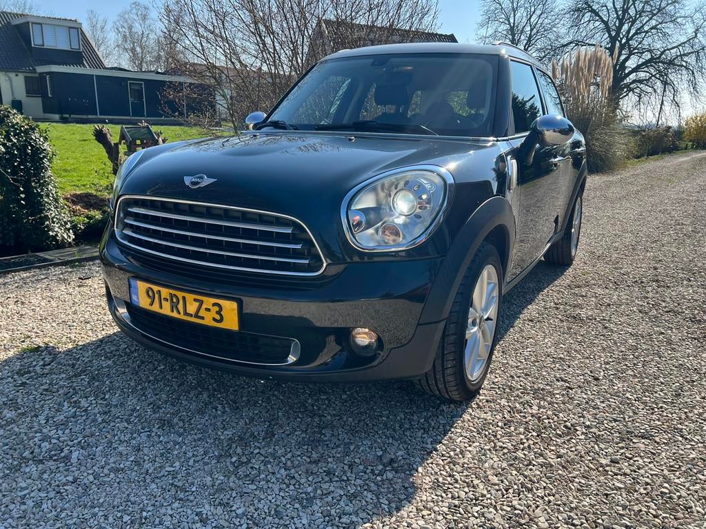 Opnieuw te koop: Mini Countryman 1.6 ONE 2011, Auto's, Mini, Voorwielaandrijving, Stof, Zwart, Zwart