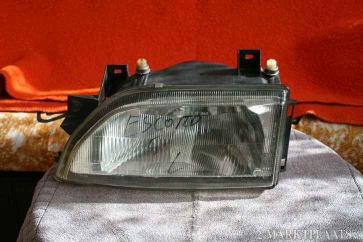 Een mooie links koplamp elektrische verstelbare Ford Escord, Ophalen of Verzenden, Gebruikt, Ford