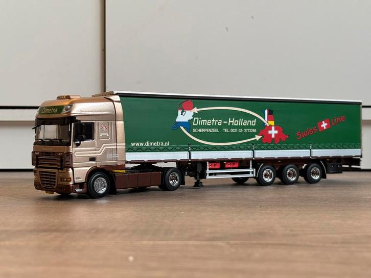 Daf XF 105 met Schuifzeiloplegger - Dimetra Scherpenzeel, Hobby en Vrije tijd, Modelauto's | 1:50, Nieuw, Bus of Vrachtwagen, Wsi