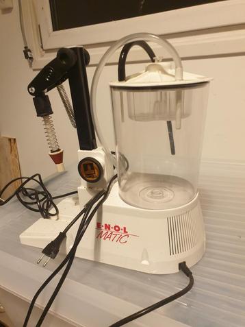 Enolmatic vacuüm bottle machine beschikbaar voor biedingen