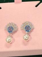 Swarovski schelp oorbellen met parel nieuww, Ophalen of Verzenden, Nieuw, Overige materialen