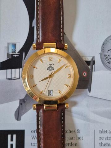 Horloge Codhor, goudkleur, lederen band, datum verzameling  beschikbaar voor biedingen