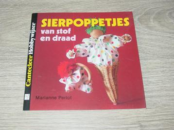 Boekje sierpoppetjes maken van stof en draad beschikbaar voor biedingen